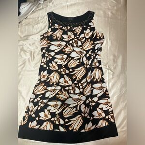 Lined sundress.  Brassy embellishments by neckline.  size 8, by Nicole Miller